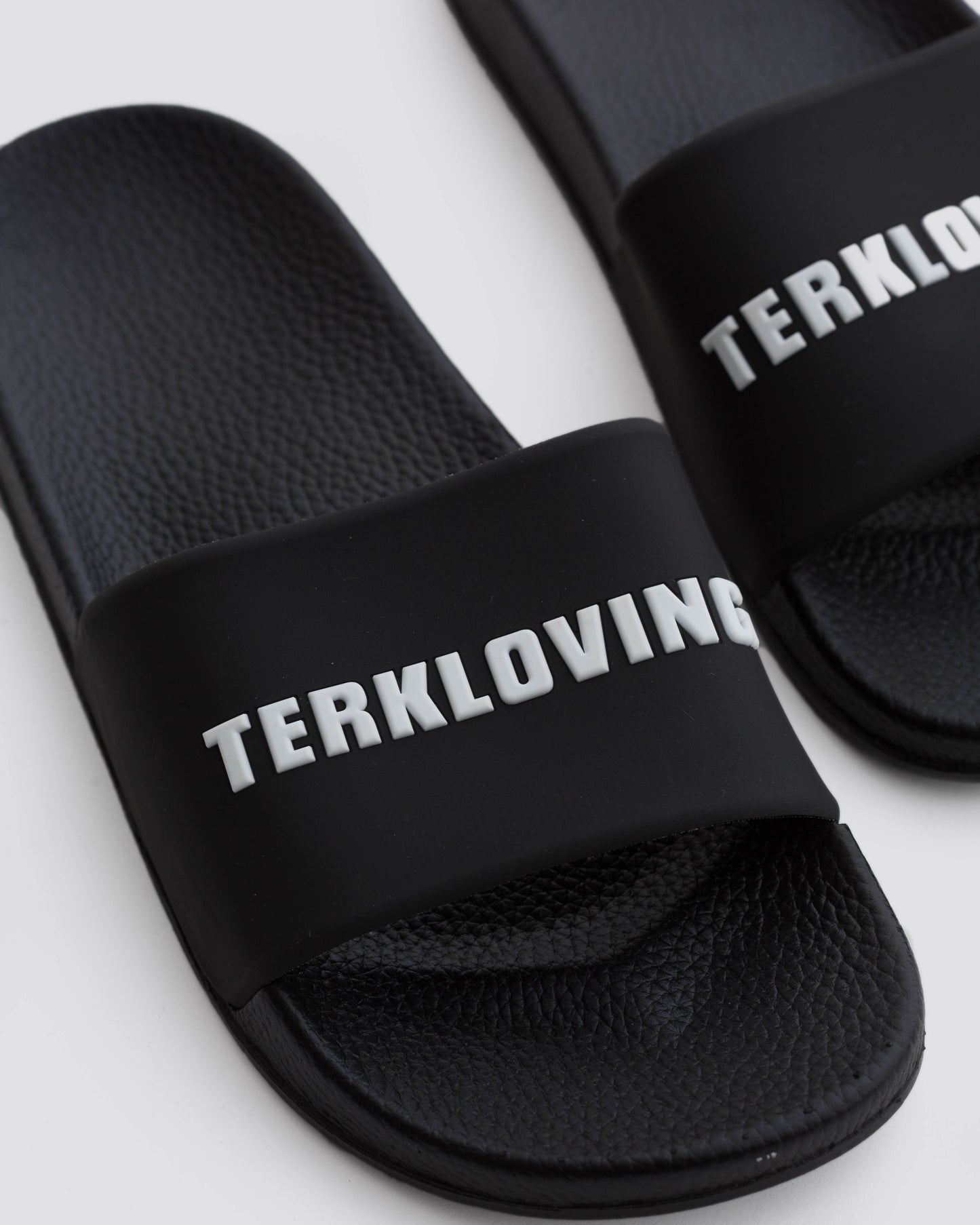 WHITE TERKLOVING LOGO SLIDE